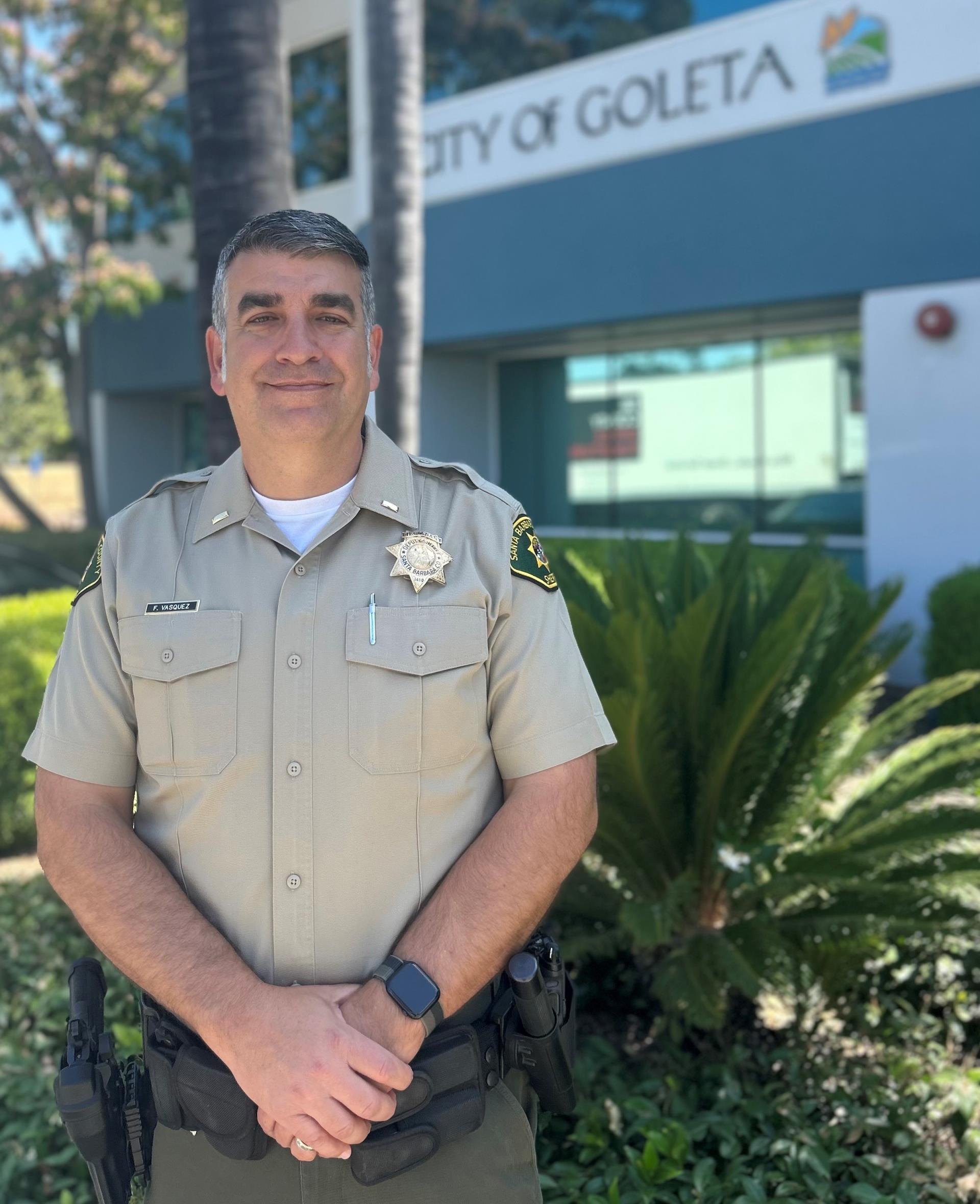 Lt. Vasquez in front of City Hall